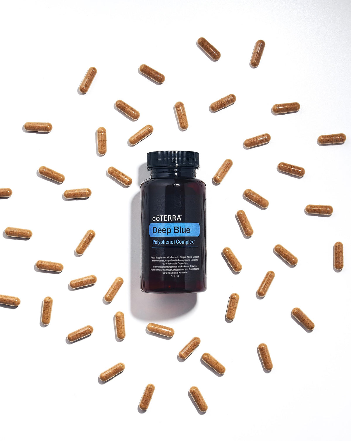 Complexe de Polyphénol Deep Blue dōTERRA, flacon et capsules en situation