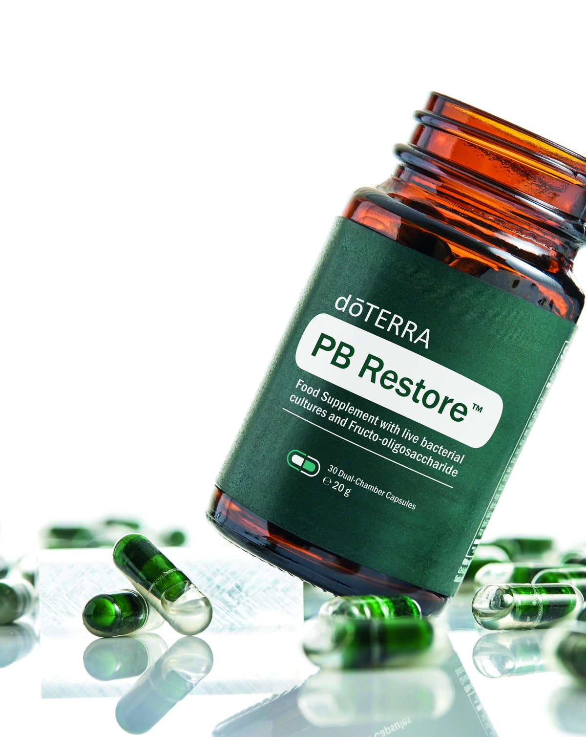 PB Restore dōTERRA, flacon et gélules vertes en studio
